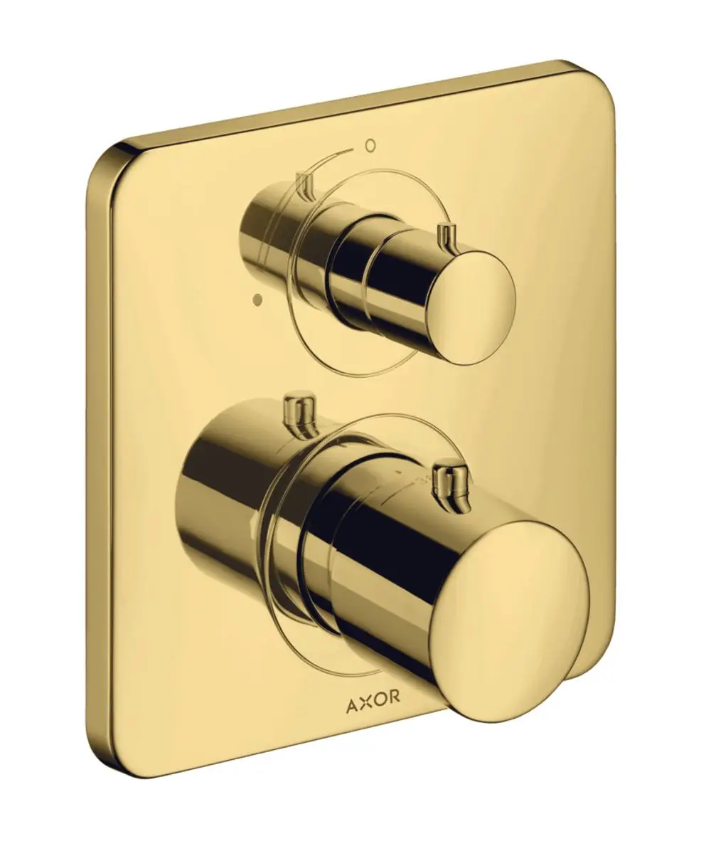 Thermostatunterputz mit zwei Reglern in glänzendem Gold-Finish, montiert auf einer quadratischen Wandplatte. Marke AXOR ist am Untergrund sichtbar.